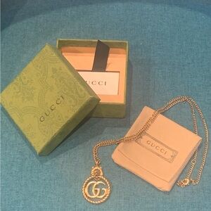 Gucci GG Lion head necklace.